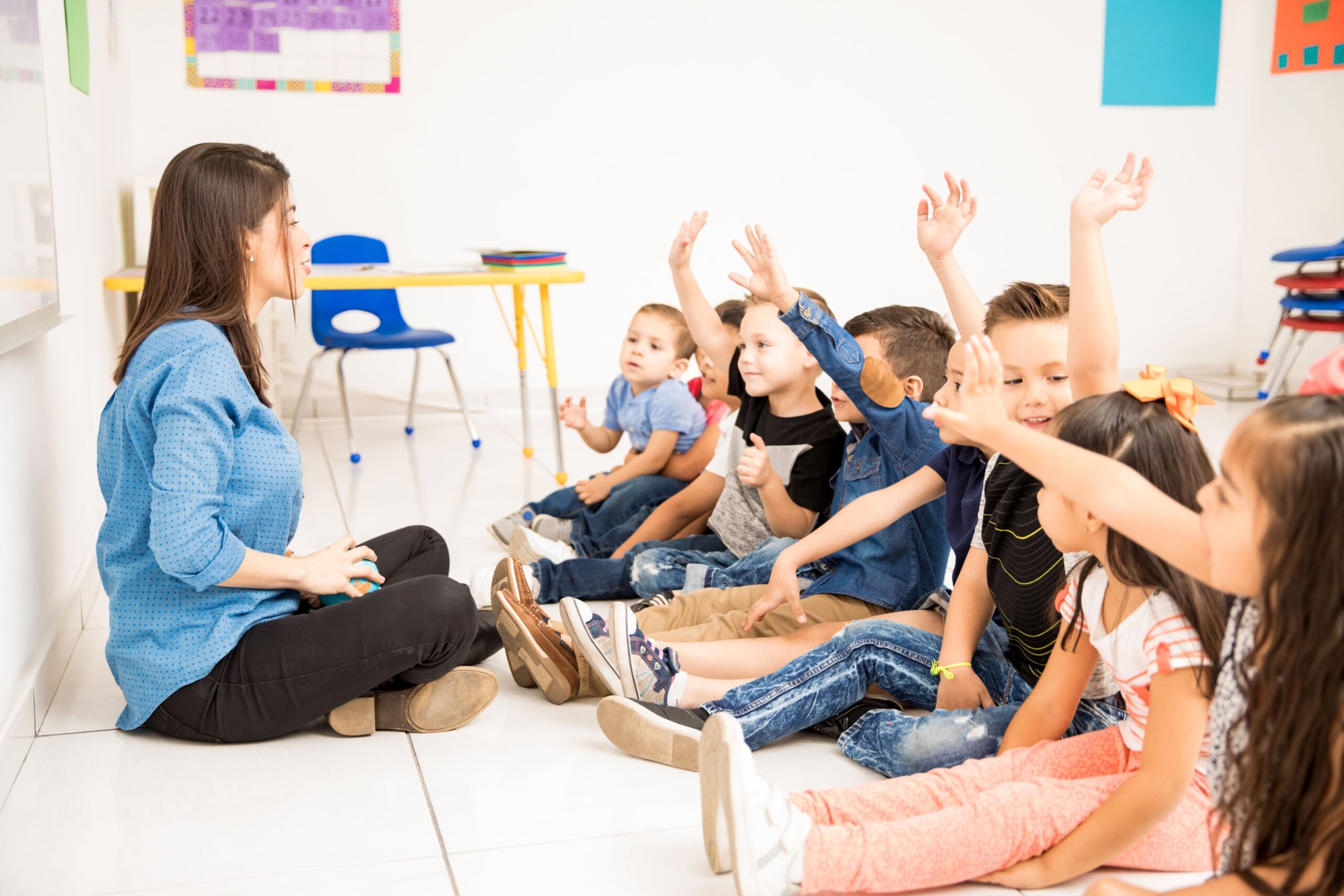 profile-view-group-preschool-students-raising-their-hands-trying-participate-school